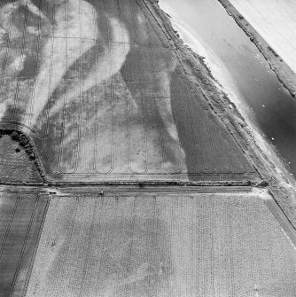 Redden, oblique aerial view, taken from the ENE, centred on the cropmarks of a possible four-poster.