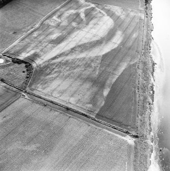Redden, oblique aerial view, taken from the NE, centred on the cropmarks of a possible four-poster.