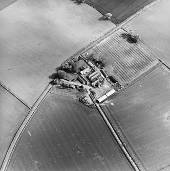 Oblique aerial view centred on the farmsteading, taken from the NNW