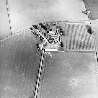 Oblique aerial view centred on the farmsteading, taken from the WNW