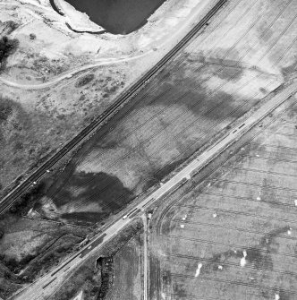 Dryburn Bridge, oblique aerial view, taken from the ESE, centred on the cropmarks of a palisaded enclosure.