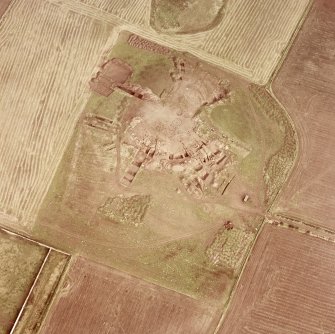 Oblique aerial view centred on the fort during excavations, taken from the SW.