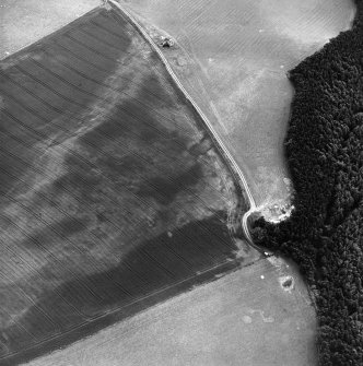 Kirklands, oblique aerial view, taken from the NNE, centred on the cropmarks of possible barrows.