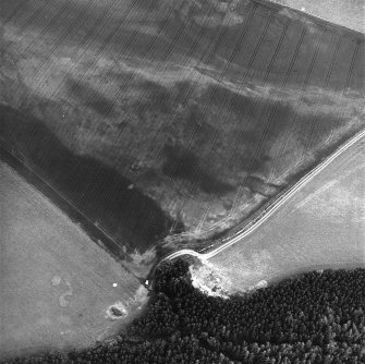 Kirklands, oblique aerial view, taken from the NW, centred on the cropmarks of possible barrows.