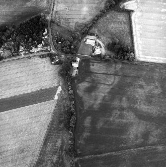 Edrom Manse, oblique aerial view, taken from the SW, centred on the cropmarks of an enclosure.