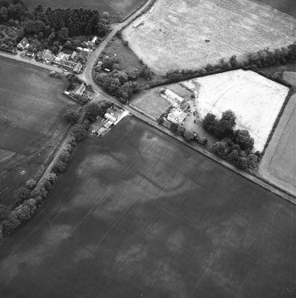 Edrom Mains, oblique aerial view taken from the SW, centred on the cropmarks of an enclosure.