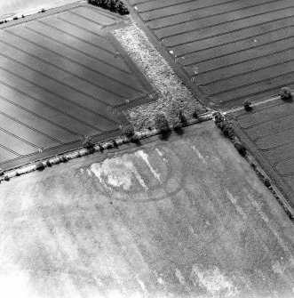 Oblique aerial view of East Reston Mill centred on the cropmarks of a settlement, taken from the NE.