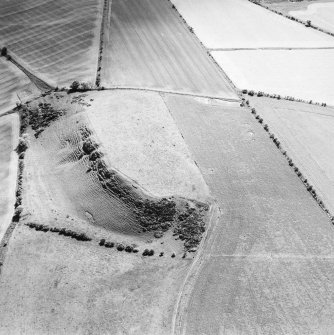 Oblique aerial view centred on the remains of the fort, taken from the NW.