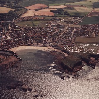 General colour oblique aerial view of the town (NT96SW 108) taken from the N with Eyemouth Fort (NT96SW 1) in the foreground.