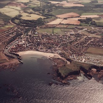 General colour oblique aerial view of the town (NW96SW 108) taken from the N with Eyemouth Fort (NT96SW 1) in the foreground.