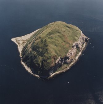 General oblique aerial view centred on Ailsa Craig, the lighthouse, cottages, foghorn and castle, taken from the NNW.