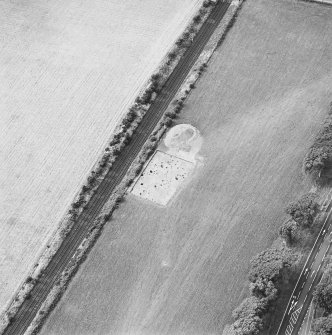 Oblique aerial view centred on the excavation of the pit-defined enclosure, taken from the ENE.