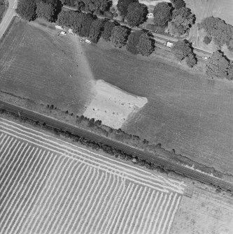 Oblique aerial view centred on the excavation of the pit-enclosure, taken from the S.
