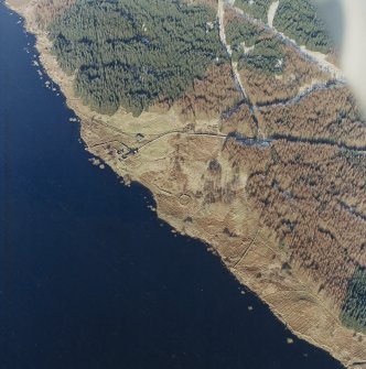 Oblique aerial view centred on the remains of the farmstead and sheepfold, taken from the WSW.