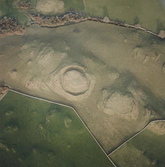 Oblique aerial view centred on the remains of the motte, taken from the SSW.