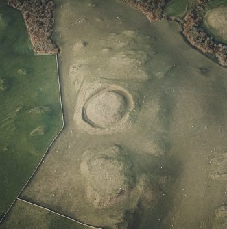 Oblique aerial view centred on the remains of the motte, taken from the SE.