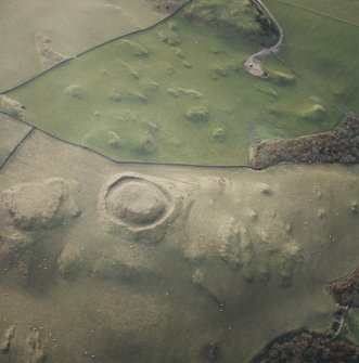 Oblique aerial view centred on the remains of the motte, taken from the NE.