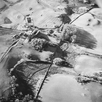 Oblique aerial view centred on the remains of the motte, taken from the ENE.