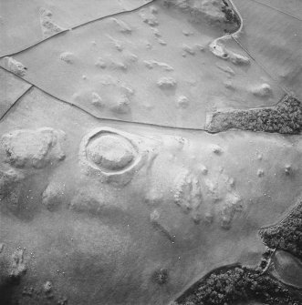 Oblique aerial view centred on the remains of the motte, taken from the NE.