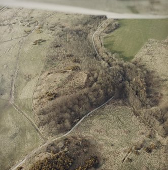 Oblique aerial view centred on the remains of the fort with tank crossing points adjacent, taken from the SSE.