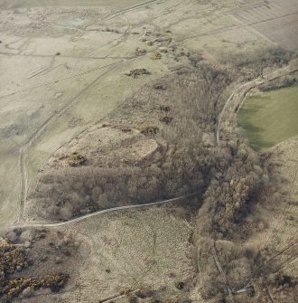 Oblique aerial view centred on the remains of the fort with tank crossing points adjacent, taken from the SW.