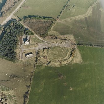Oblique aerial view centred on the remains of the fort and tank firing platform, taken from the W.