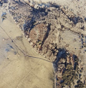 Oblique aerial view centred on the remains of the fort, taken from the SW.