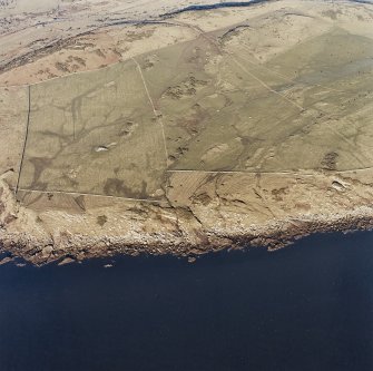 Oblique aerial view centred on the remains of rig with observation bunker adjacent, taken from the S.