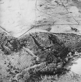 Oblique aerial view centred on the remains of the fort, taken from the ESE.