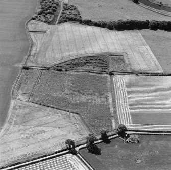 Oblique aerial view of Culvennan, taken from the NE, centered on cropmarks.