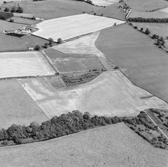 Oblique aerial view of Culvennan, taken from the W, centered on cropmarks.