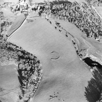 Oblique aerial view centred on the remains of the homestead, taken from the WNW.