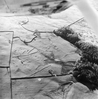 Oblique aerial view centred on the remains of the farmstead, field-system and rig with possible homestead, farmstead, field-system and rig adjacent, taken from the ESE.