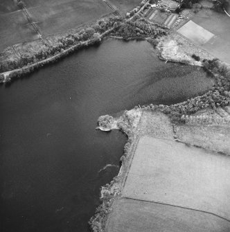 Oblique aerial view centred on the remains of the crannog, taken from the NE.