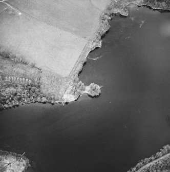 Oblique aerial view centred on the remains of the crannog, taken from the SW.