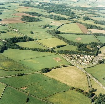 Oblique aerial view of Holywood centred on the excavations at The Twelve Apostles stone circle and two cursuses, taken from the SSW.
