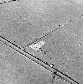 Oblique aerial view of The Twelve Apostles centred on the excavation of the stone circle, taken from the S.