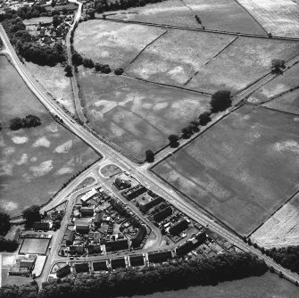 Holywood and Kilncroft, oblique aerial view, taken from the NNE, centred on the southern cursus monument and surrounding cropmarks. Further linear cropmarks are visible in the left centre of the photograph, and the 12 Apostles stone circle appears in the top right-hand corner.
