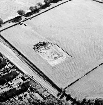 Oblique aerial view of Holywood centred on the excavation of a cursus and ring-ditch, taken from the NNE.