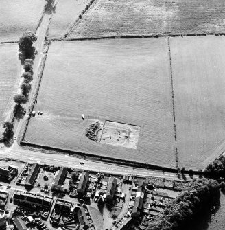 Oblique aerial view of Holywood centred on the excavation of a cursus and ring-ditch, taken from the ENE.