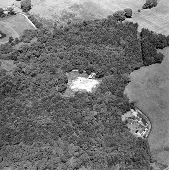 Oblique aerial view centred on the excavation of the old castle, taken from the SW.