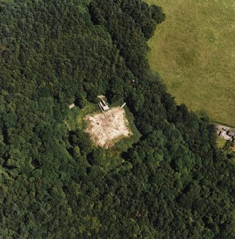 Oblique aerial view centred on the excavation of the old castle, taken from the SW.