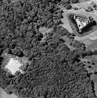 Oblique aerial view centred on the excavation of the old castle with castle adjacent, taken from the E.