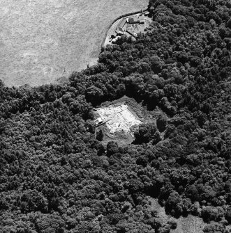 Oblique aerial view centred on the excavation of the old castle, taken from the NW.