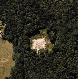Oblique aerial view centred on the excavation of the old castle, taken from the NE.