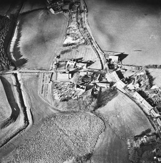 Dalton, oblique aerial view, taken from the SE, centred on the old parish church and the parish church.  A road bridge is visible in the centre left hand side of the photograph.