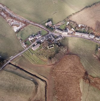 Dalton, oblique aerial view, taken from the SSW, centred on the old parish church and the parish church.  A road bridge is visible in the bottom left hand corner of the photograph.