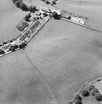 Oblique aerial view of Fairholm, taken from the E, centred on the cropmarks of a fort.