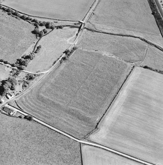 Oblique aerial view of Birrens, taken from the NNW, centred on a Roman Fort.