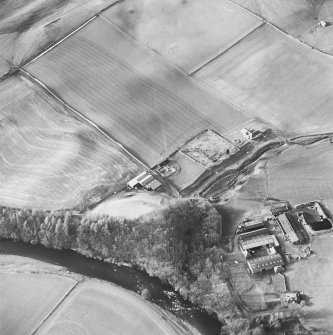 Oblique aerial view from SE, centred on Staplegordon old parish church and Barntalloch motte-and-bailey castle. Potholm farmsteading is visible in the bottom right-hand corner of the photograph.